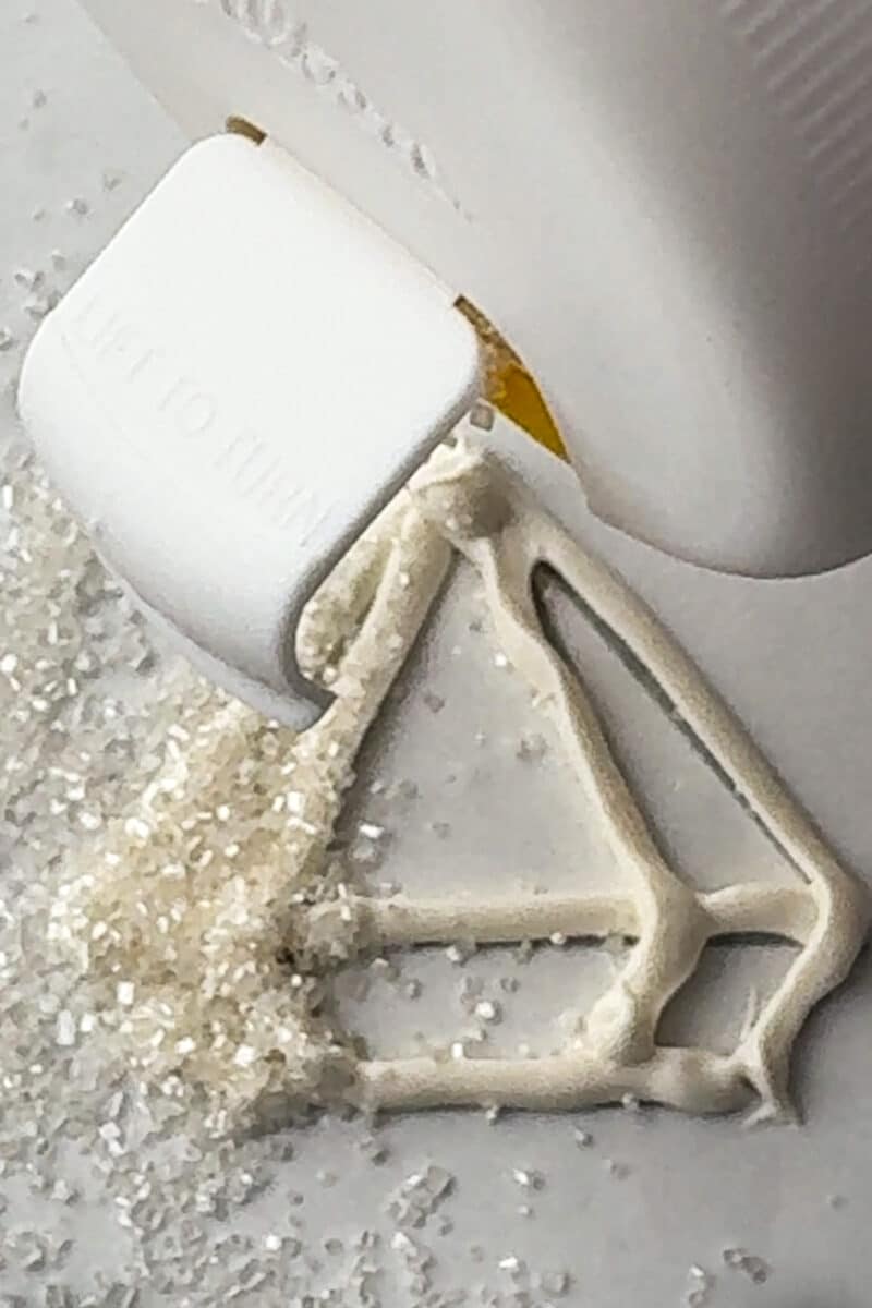 white sprinkles sprinkled over white chocolate