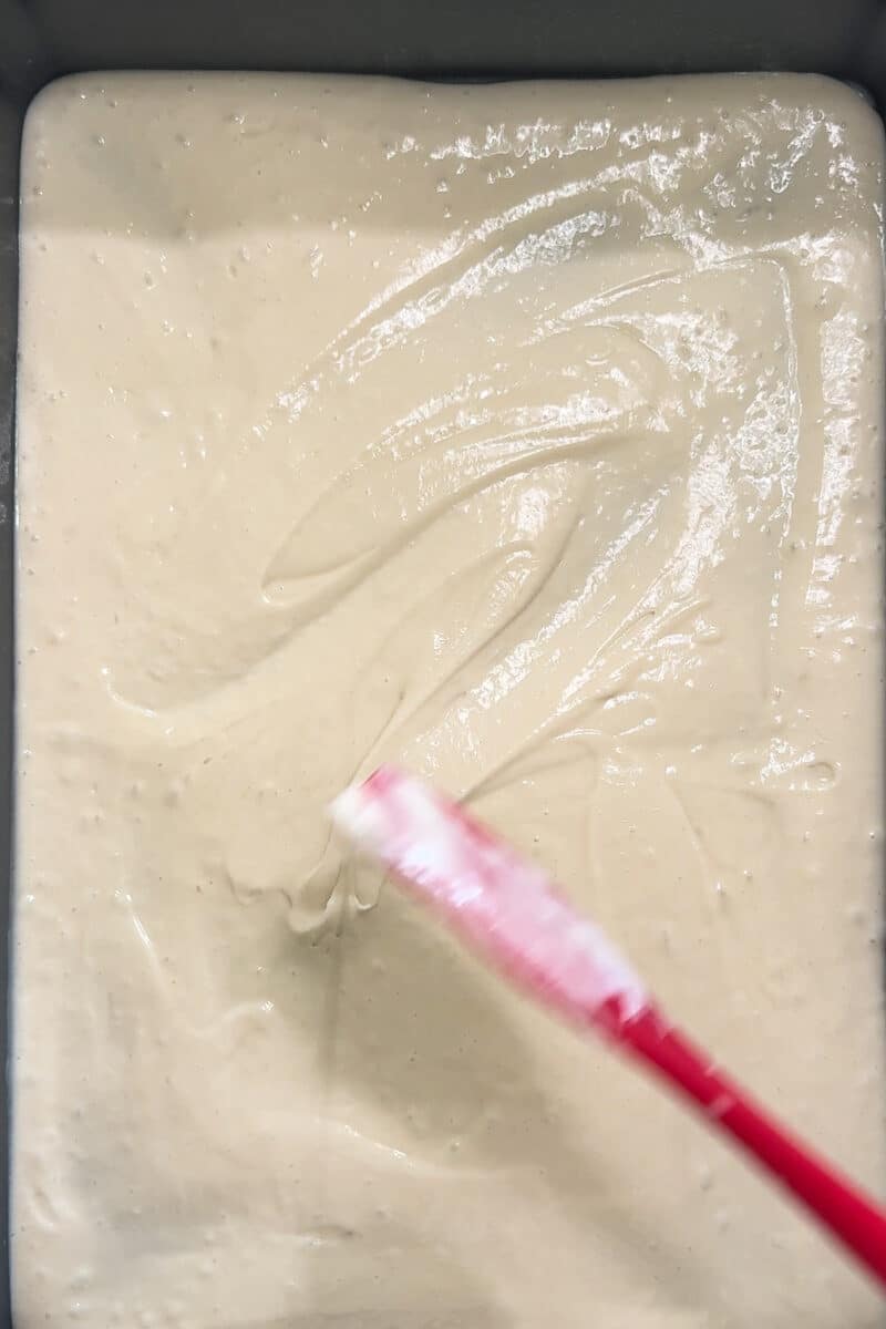 white batter in a cake pan
