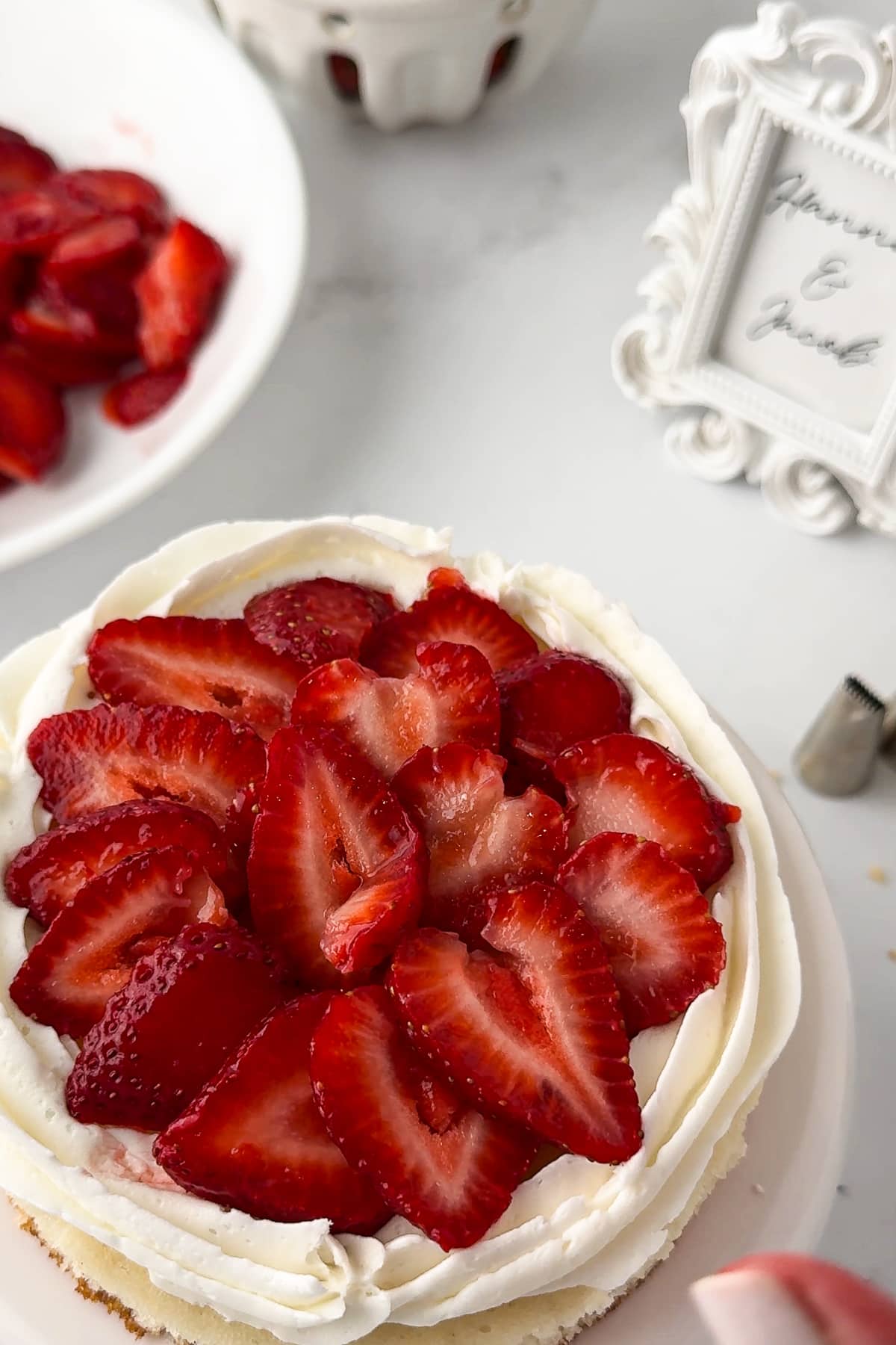 strawberries layered on top of a cake