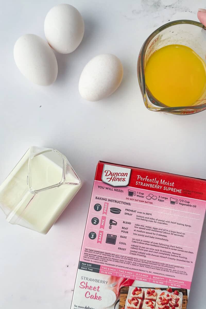 3 eggs, melted butter, Duncan Hines strawberry cake mix, milk