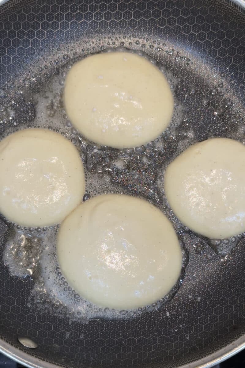 hexclad frying pan with butter and high protein pancakes made with cottage cream
