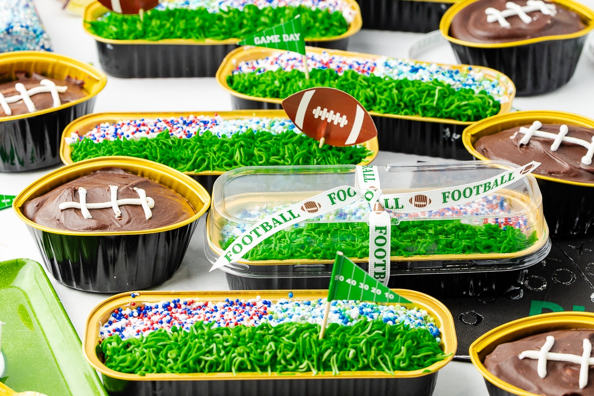 mini loaf pans decorated like a stadium and cupcakes decorated like a football